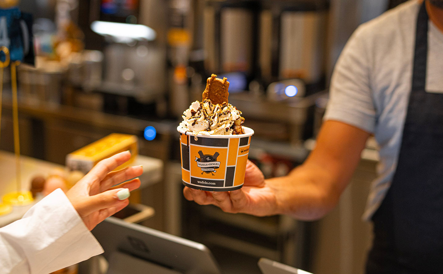 Customer reaching for his Wham Bam waffle